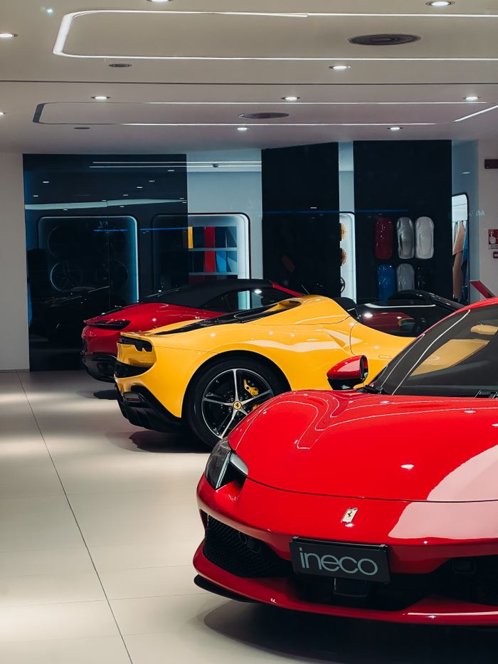 Showcase of sleek luxury sports cars in an elegant indoor showroom.